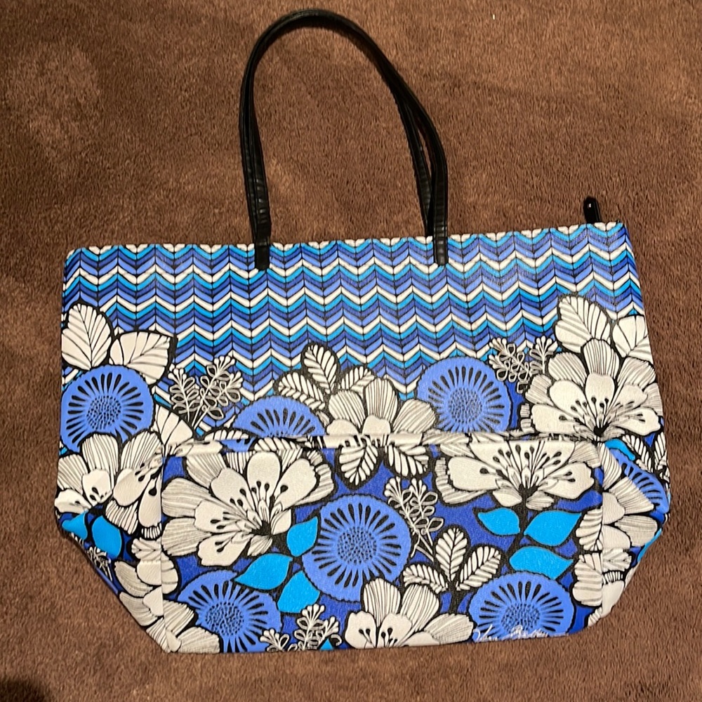 Vera Bradley bag, not cloth but more of an outdoor material measures 13 x 20.5”